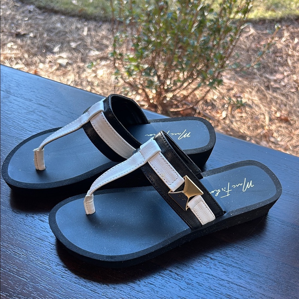 Stylish Black and White Sandals with Gold accents Marc Fisher.  Size 7.5